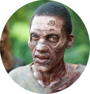 A close up image of a zombies face